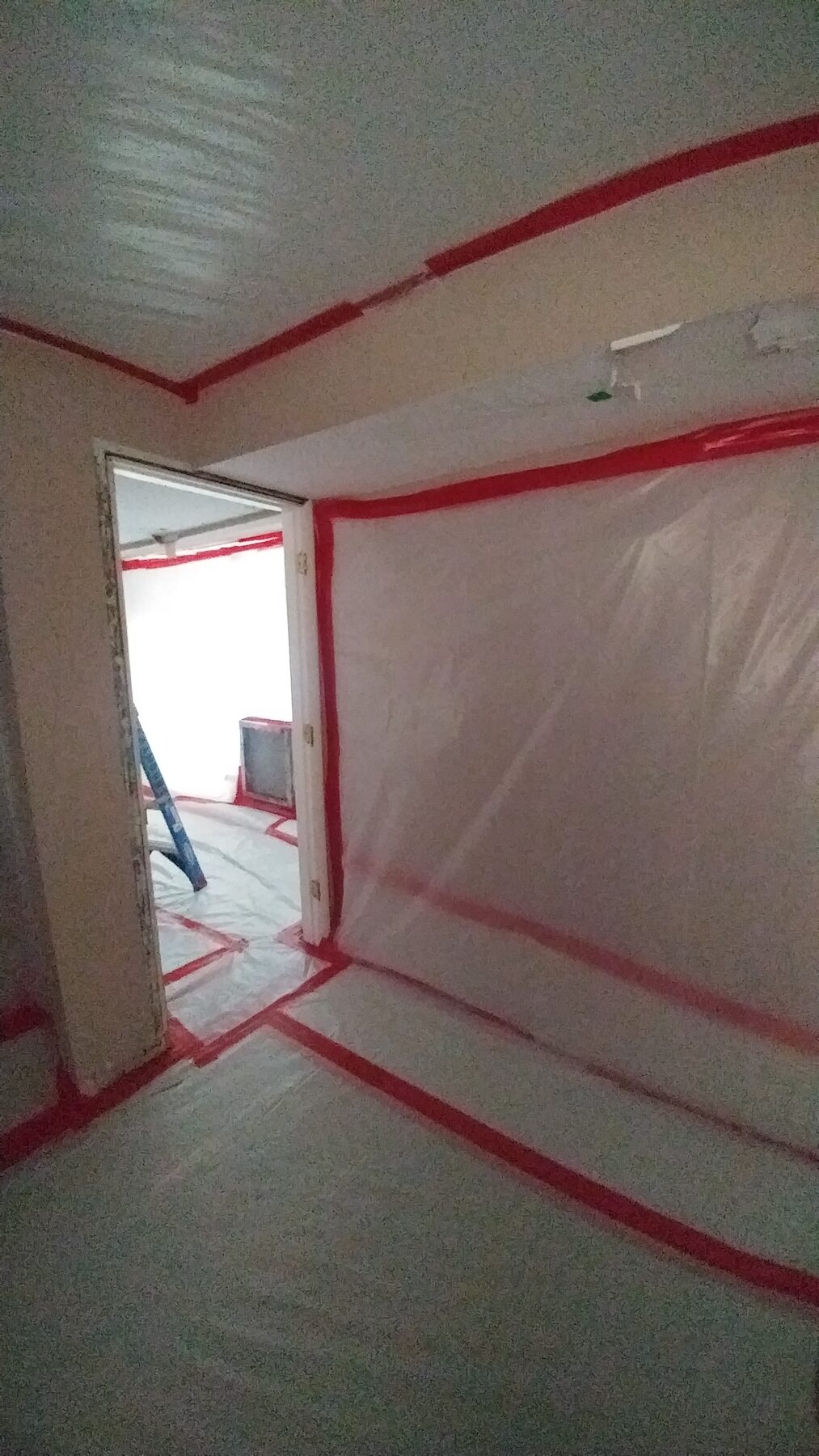 Interior room prepped with critical barriers and floor protection